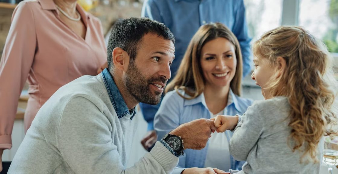 multi-generation-family-enjoying-time-together-home-focus-is-happy-father-talking-his-small-daughter-making-agreement-with-her_637285-5498